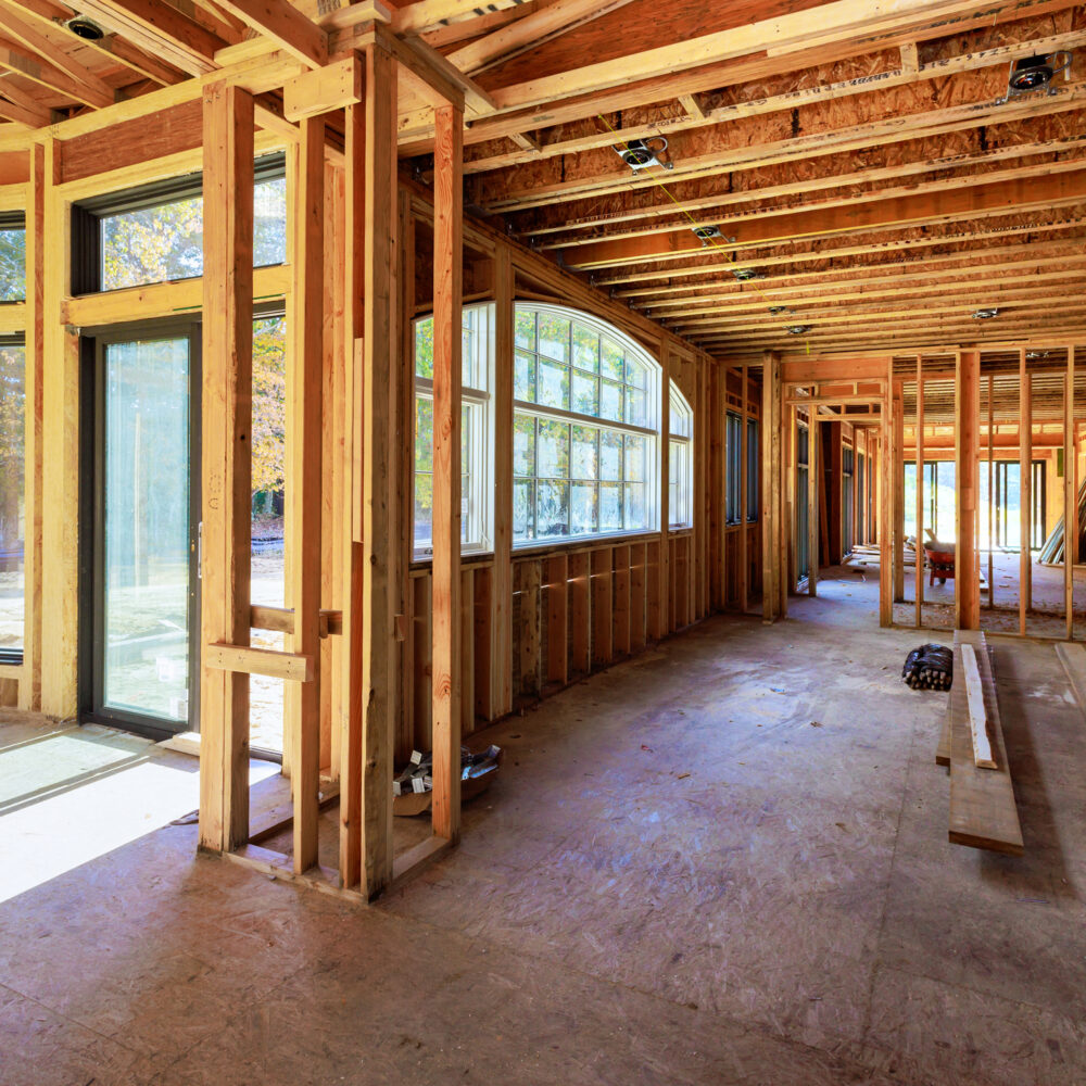 Newly constructed home improvement project in process of framing beams for wooden house in construction area
