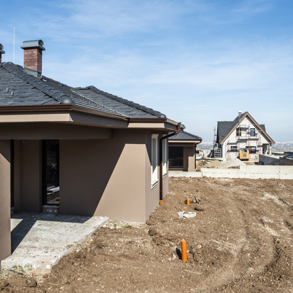 New build houses. Sunny day. Construction site