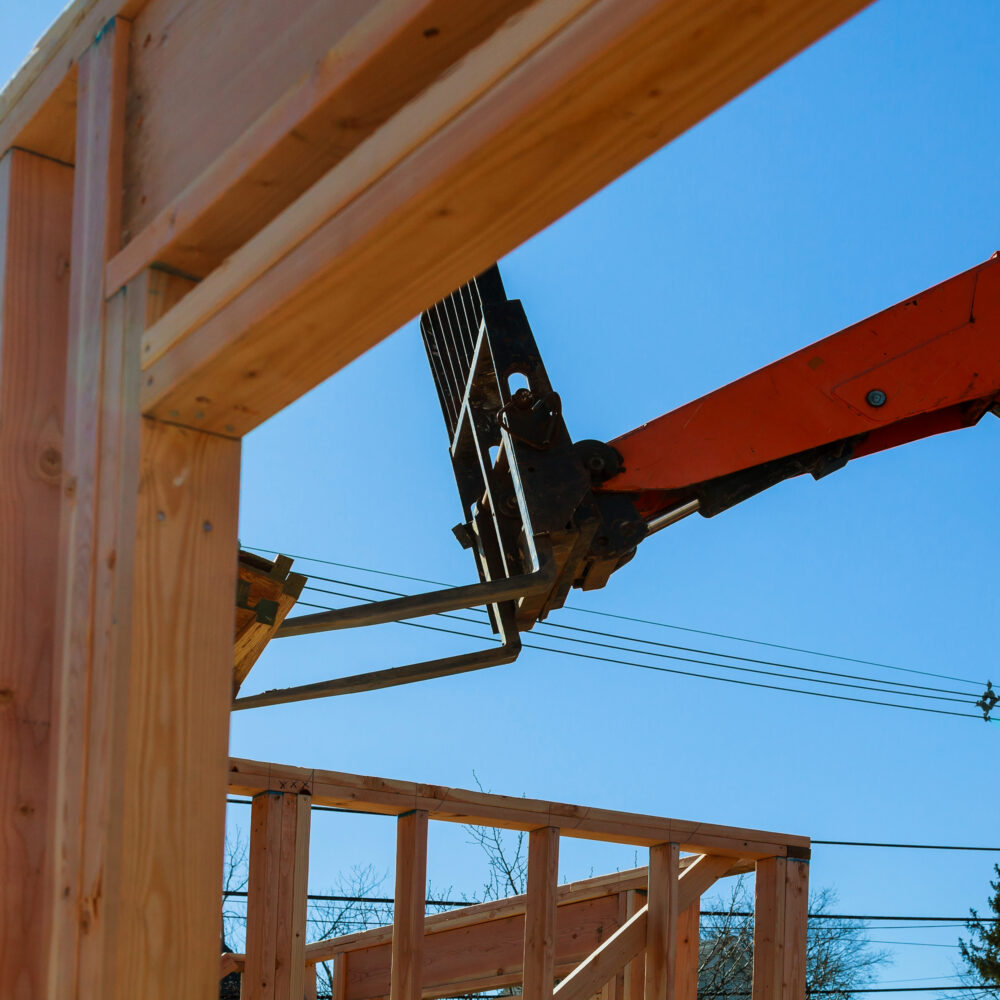 Residential construction home framing view on new house wooden under construction