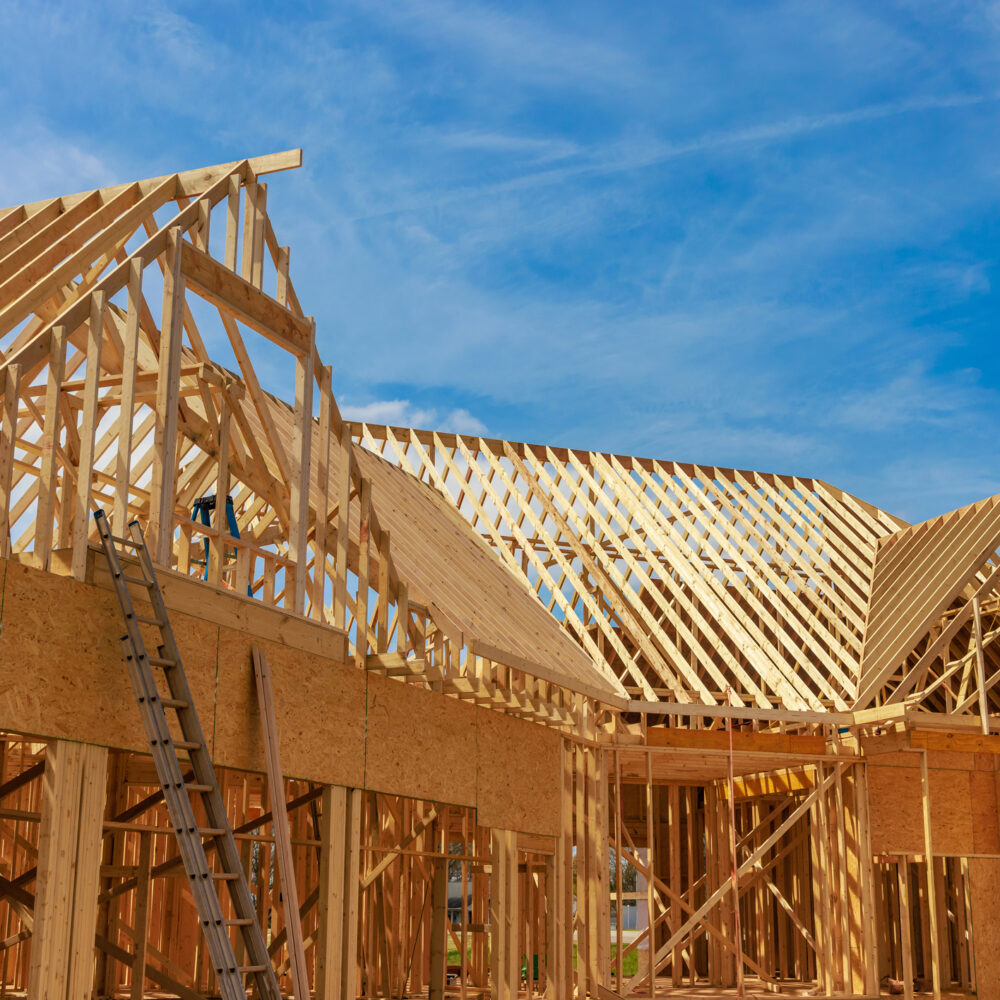 The framing beams of a house in construction.